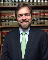 Headshot of attorney John A. Karol